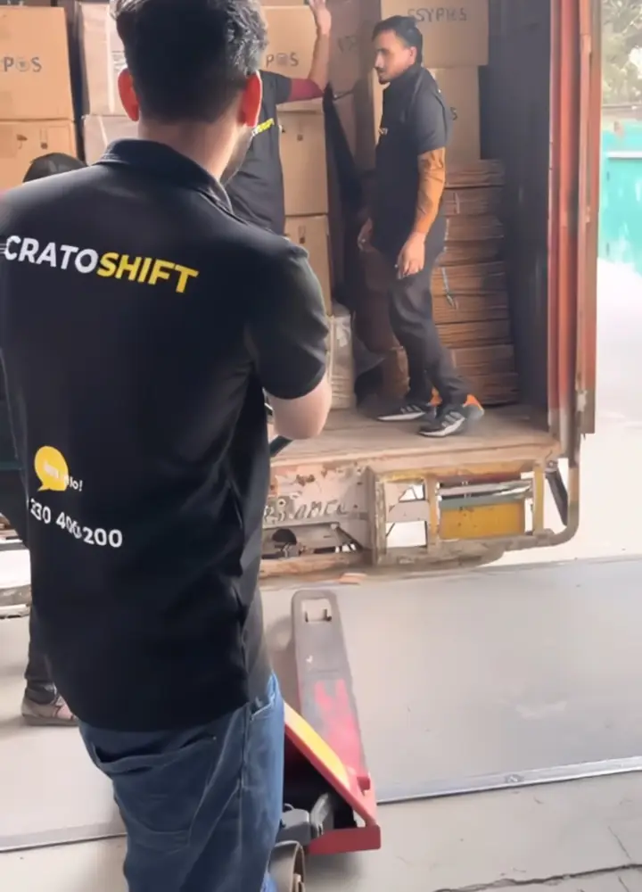 CratoShift crew loading cartons into a closed container truck