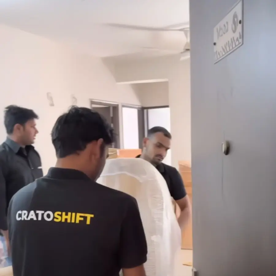 CratoShift movers wrapping furniture during a Gurgaon relocation
