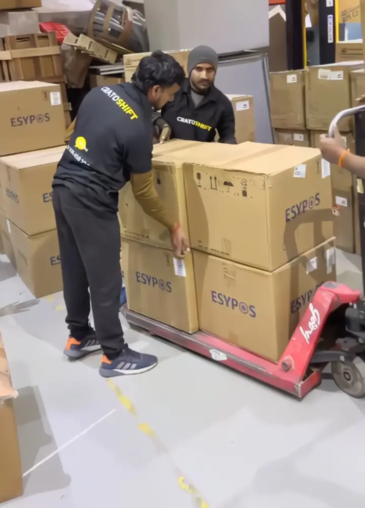 Labelled cartons stacked on a pallet truck inside the CratoShift warehouse