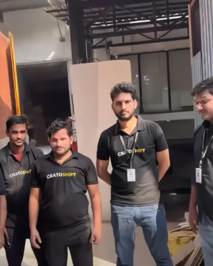 Uniformed CratoShift crew wearing photo ID lanyards at the warehouse
